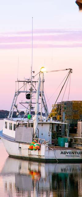 A small boat docked in a harbor.