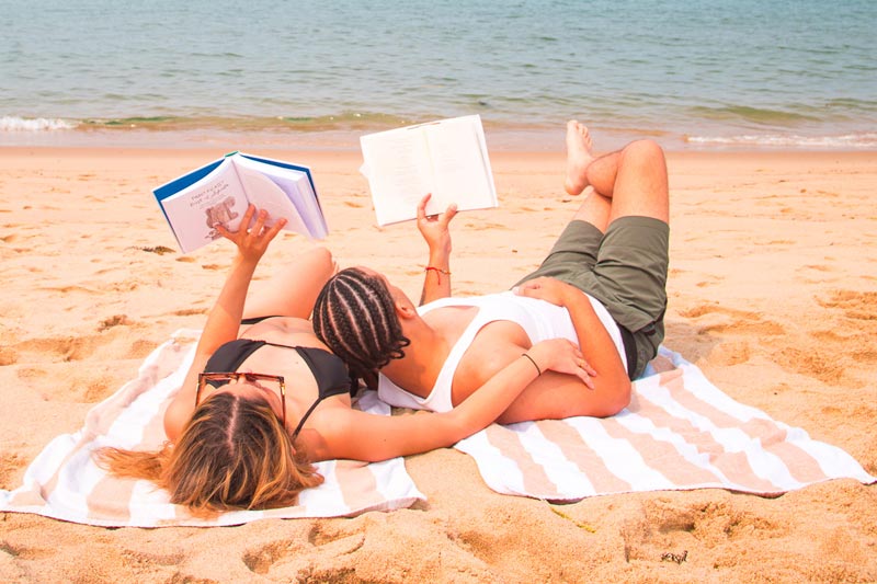 A couple reading on the beach